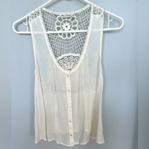 Sheer cream tank style top.